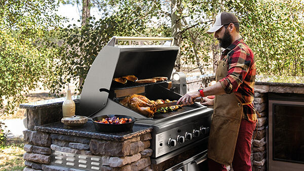 David Stanley using his DCS grill in his outdoor kitchen